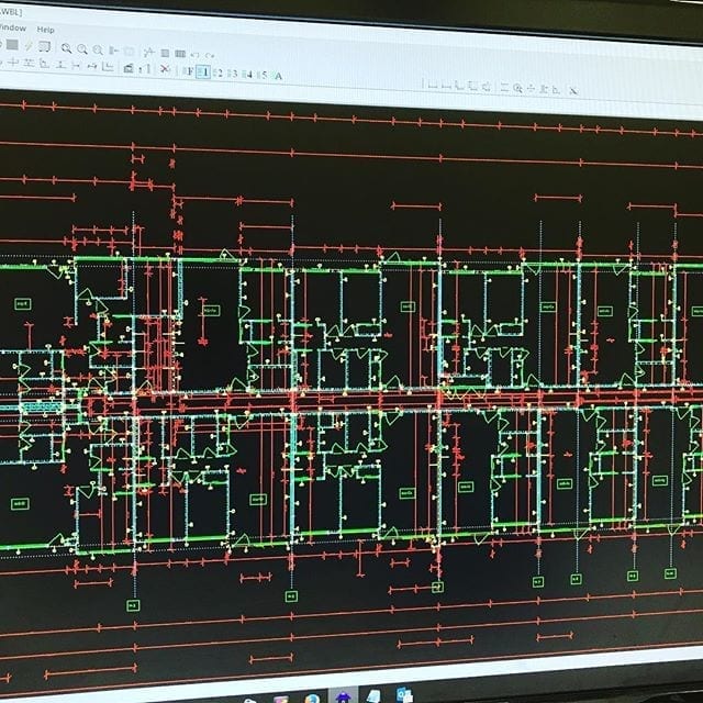 Photo of digital blueprints being displayed on a computer screen